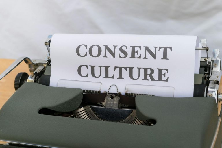 Close-up of the words 'Consent Culture' typed on paper in a vintage typewriter.